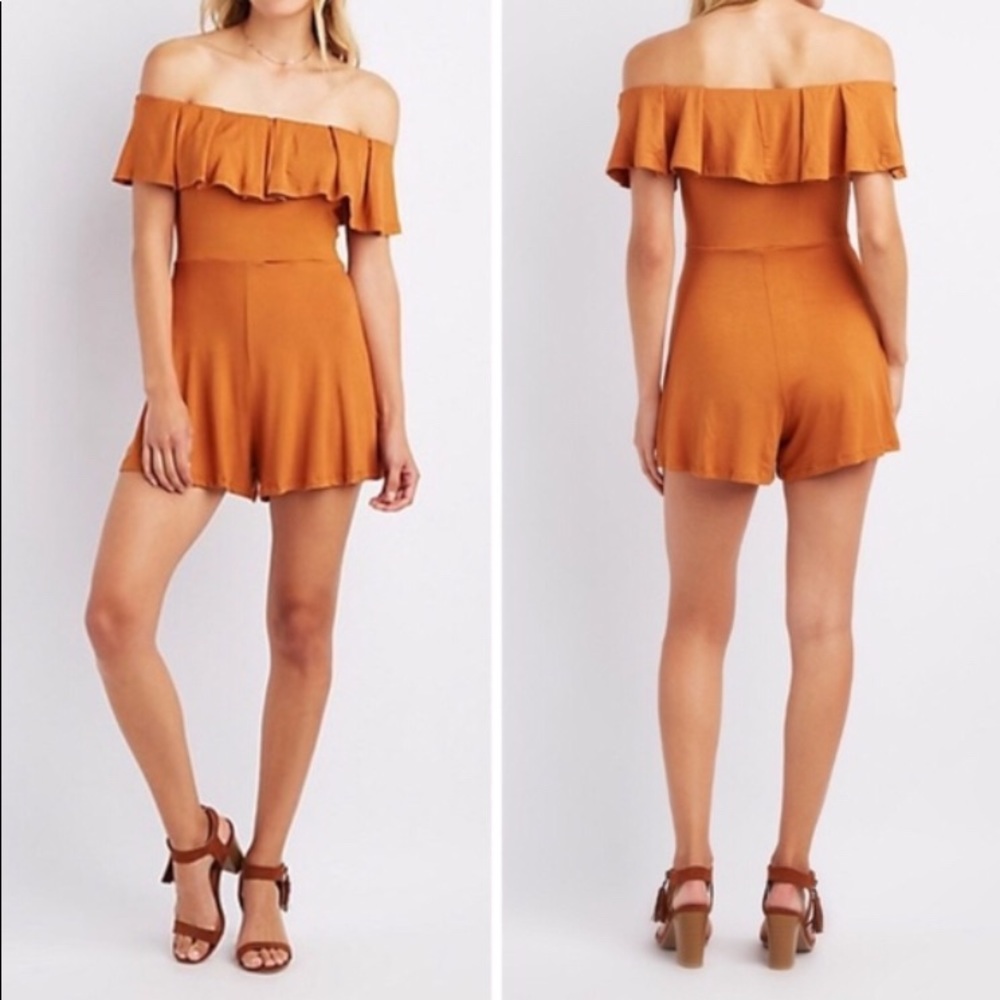 Orange ruffled off shoulder romper.